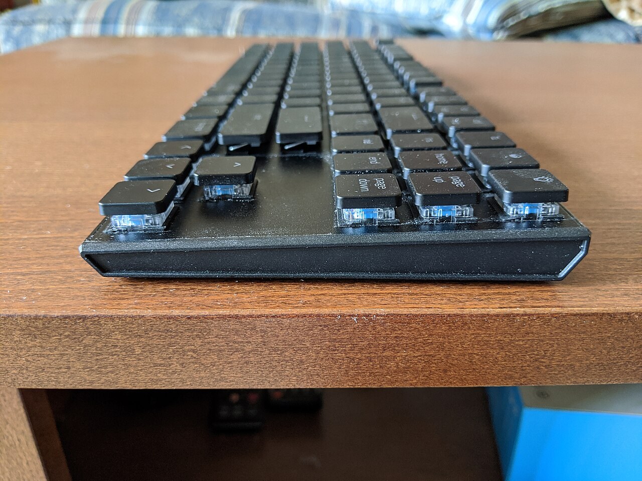 Side profile of a Keychron K1 keyboard showing shallow keycaps above its base